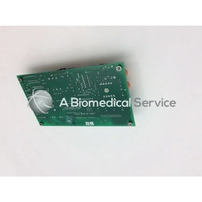 Green rectangular circuit board a125-007 with silver components and white wire on circular sensor board+a125-007 rev
