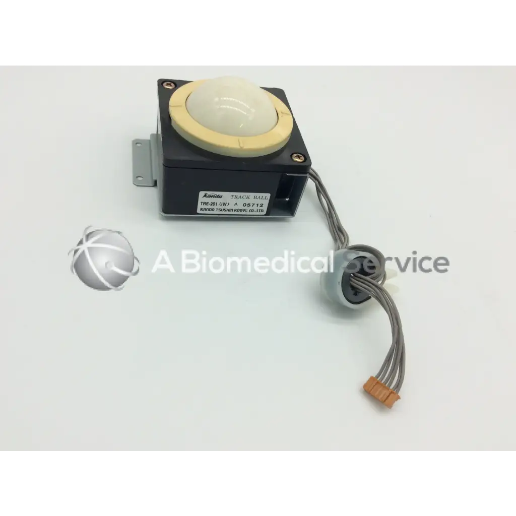 Black kuroda track ball with cream top and beige rubber ring with gray cables and orange connector kanda tsushin kogyo track ball
