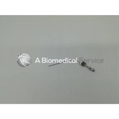 A metallic karl storz suction tip 10 fr medical syringe with a clear barrel and silver-colored needle for precise suction