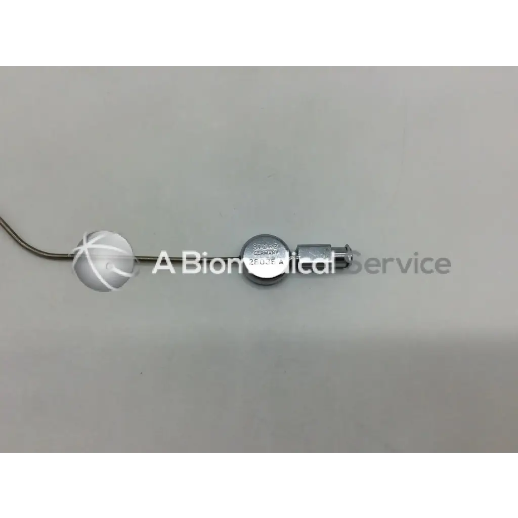 Silver metallic karl storz 28035 a handpiece instrument with spherical end engraved storz germany on cylindrical body
