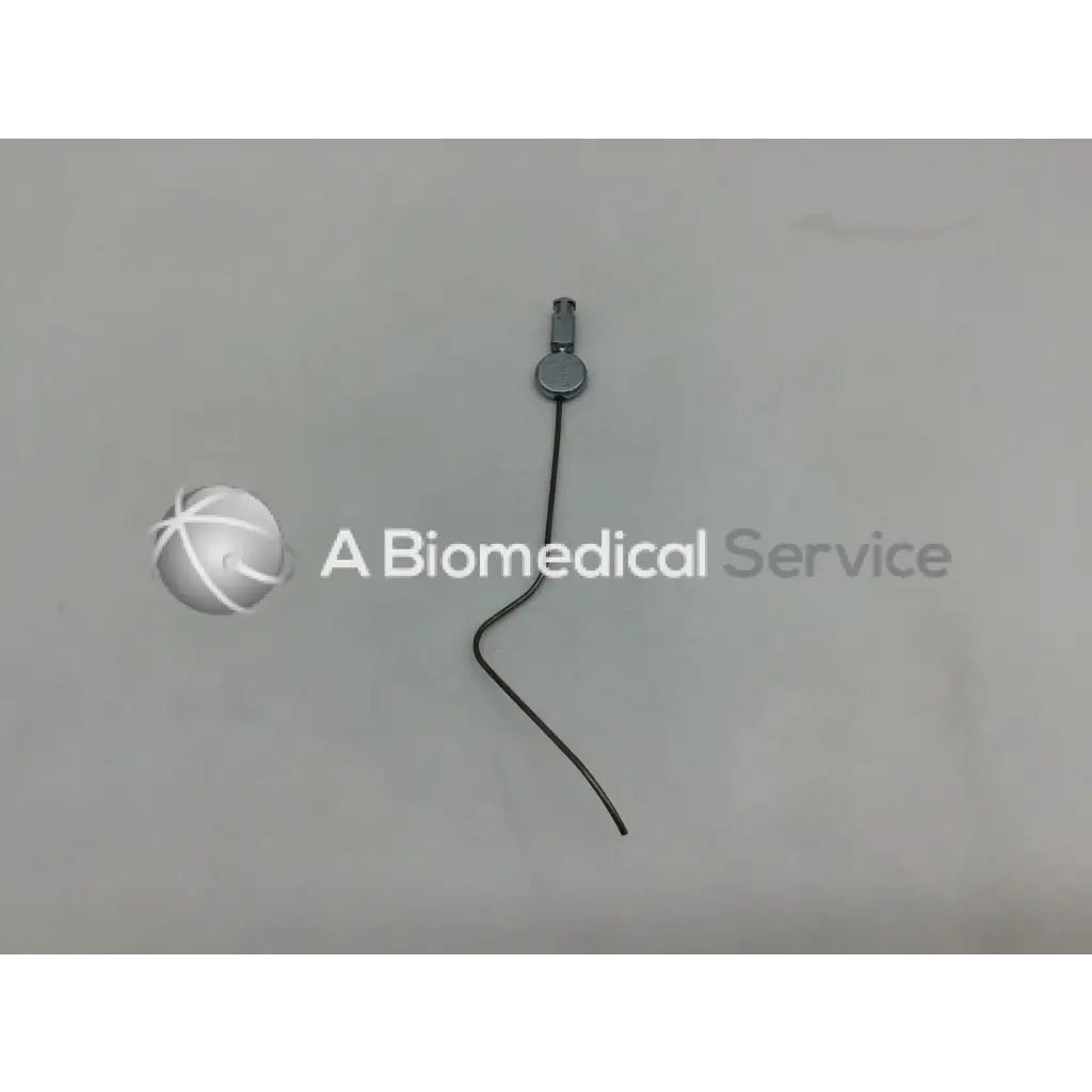 A sleek black karl storz handpiece instrument ac5-287 with a metallic circular connector and thin wire extending from it