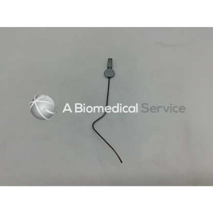 A sleek black karl storz handpiece instrument ac5-287 with a metallic circular connector and thin wire extending from it
