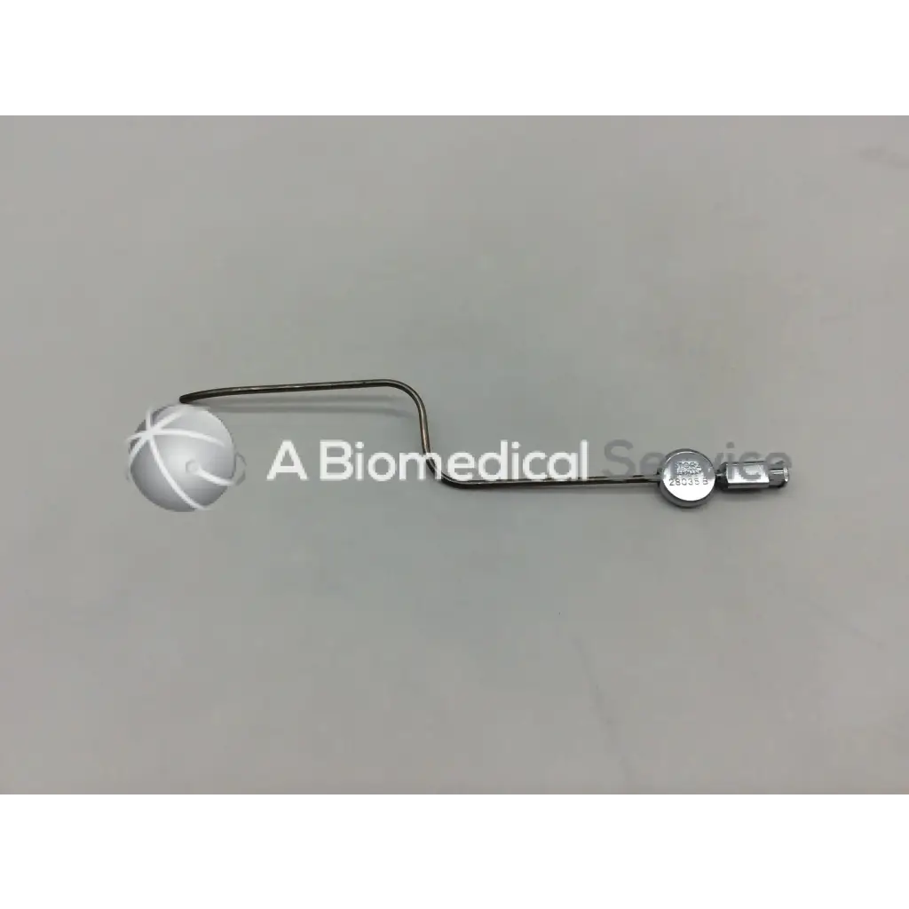 Silver metal karl storz 28035 b handpiece instrument with curved handle and circular component at the end