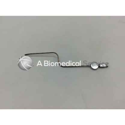 Silver metal karl storz 28035 b handpiece instrument with curved handle and circular component at the end