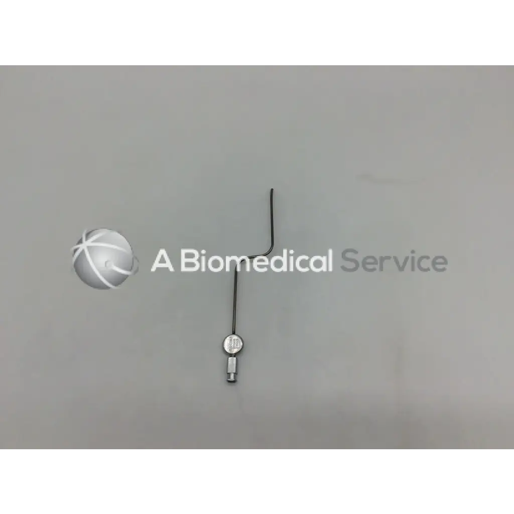 Silver metallic karl storz 28035 b handpiece instrument with curved wire handle and circular end component