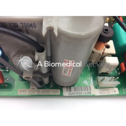 Gray cylindrical capacitor with white label and black text mounted on green circuit board of lares 105 bbce5-3 board