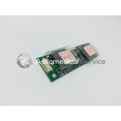 Green rectangular lcd inverter board gh166a with black electronic components and red warning labels for display power control
