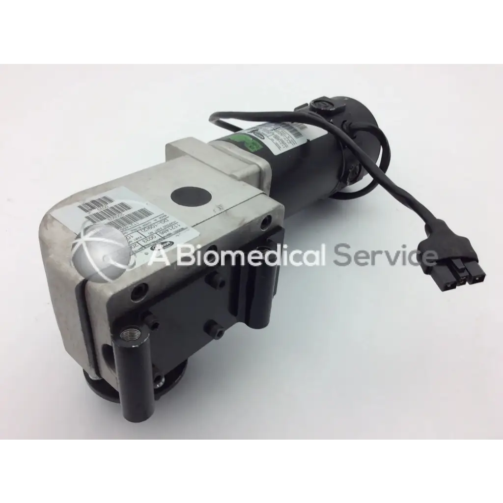 Black and silver left motor for invacare pronto m91 powerchair with coiled power cable and connector visible from the back side