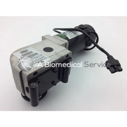Black and silver left motor for invacare pronto m91 powerchair with coiled power cable and connector visible from the back side