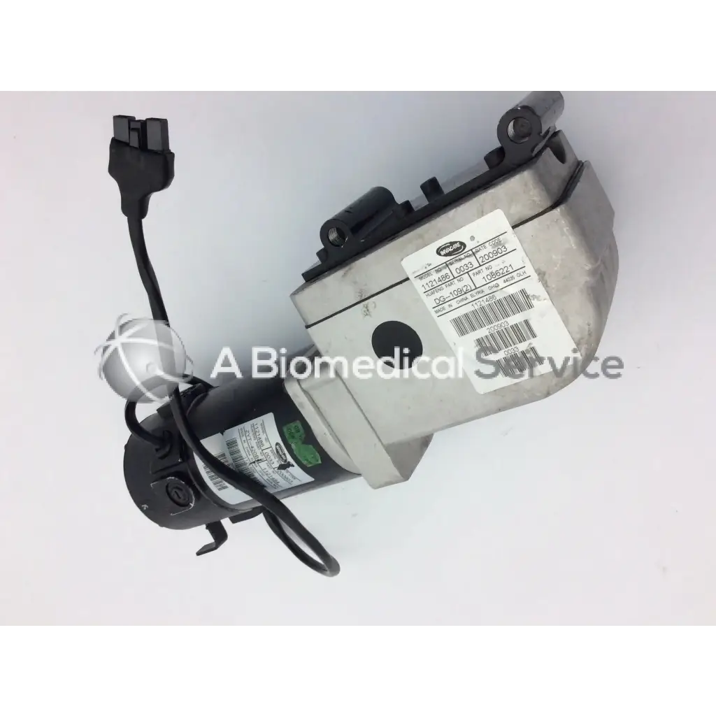 Gray and black industrial left motor for invacare pronto m91 powerchair with original medical equipment label