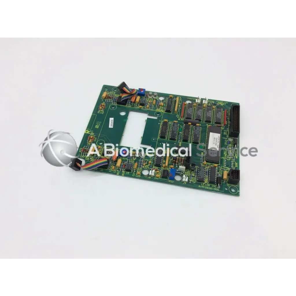 Leica a n 12450-925 board showing green rectangular circuit board with black integrated circuits and electronic components
