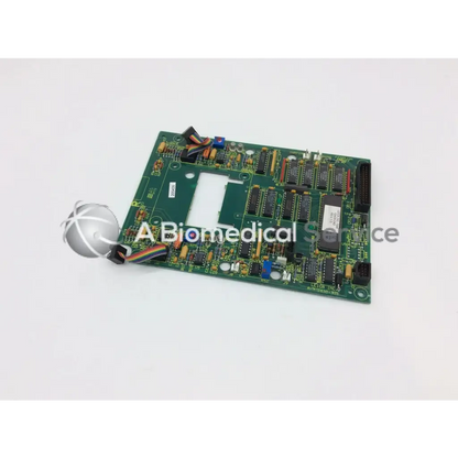Leica a n 12450-925 board showing green rectangular circuit board with black integrated circuits and electronic components