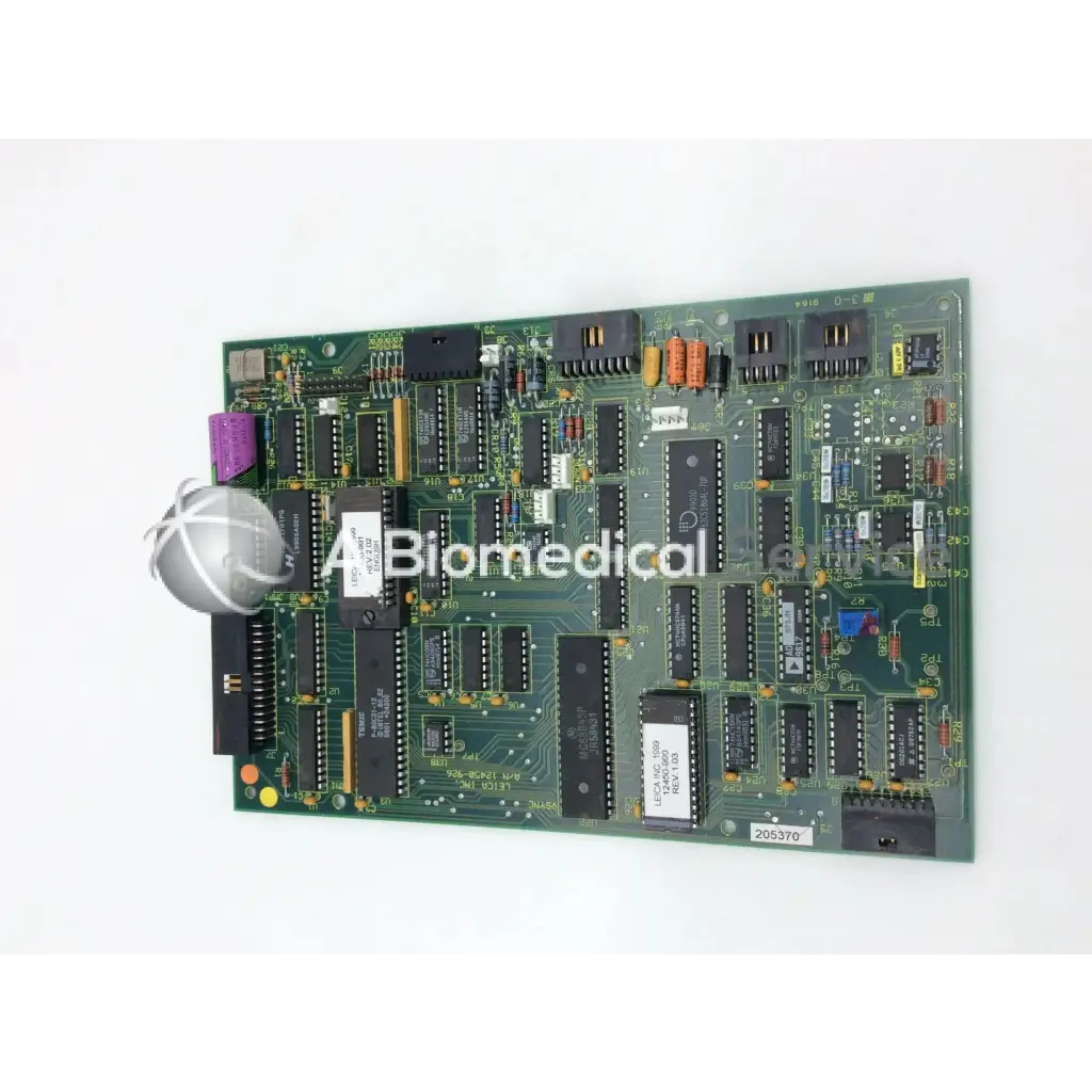 Leica a n 12450-926 board showing green printed circuit board with black chips orange yellow capacitors and purple part