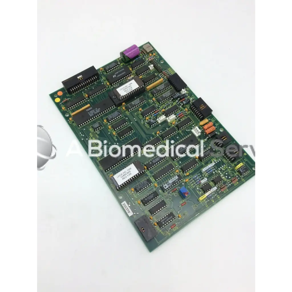 Leica a n 12450-926 board showing green printed circuit board with black integrated circuits purple capacitor and connectors