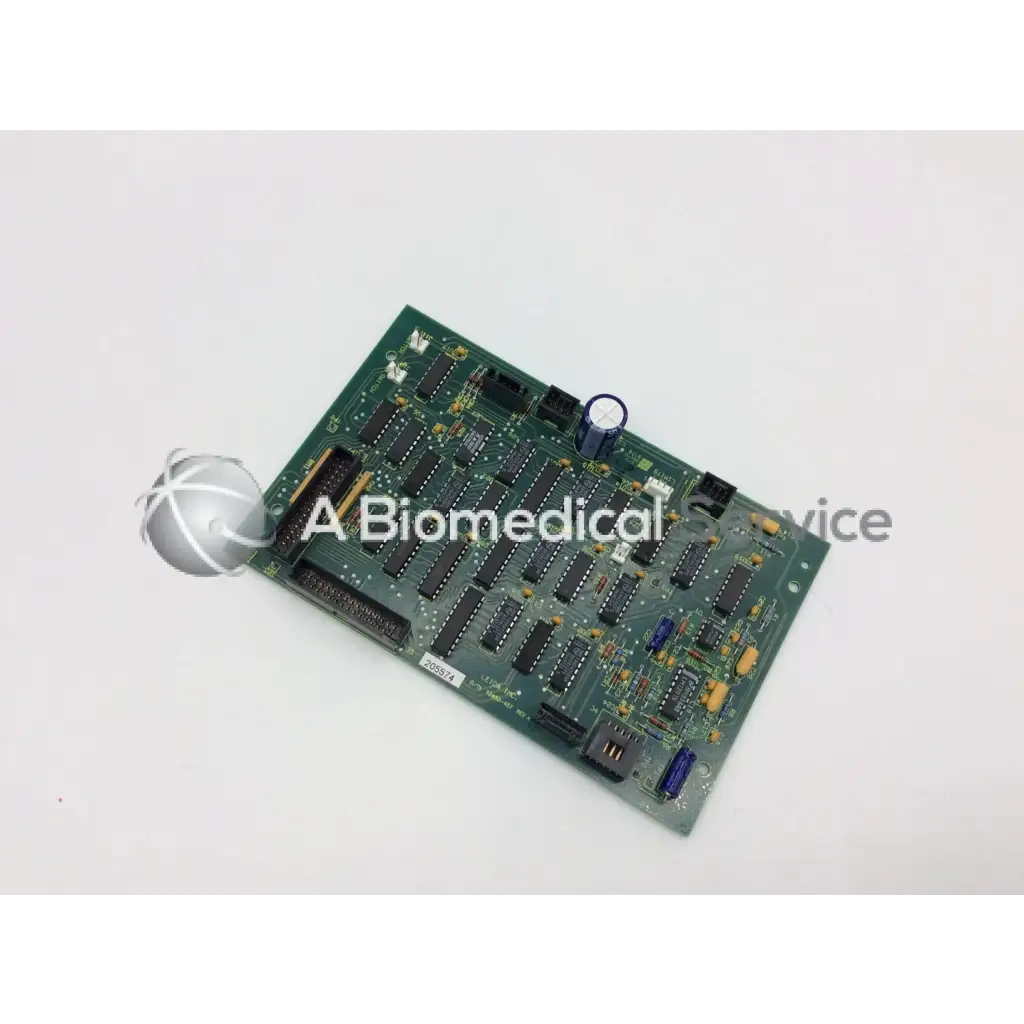 Leica inc A/N 12450-457 rev a green circuit board with black integrated circuits and blue capacitors