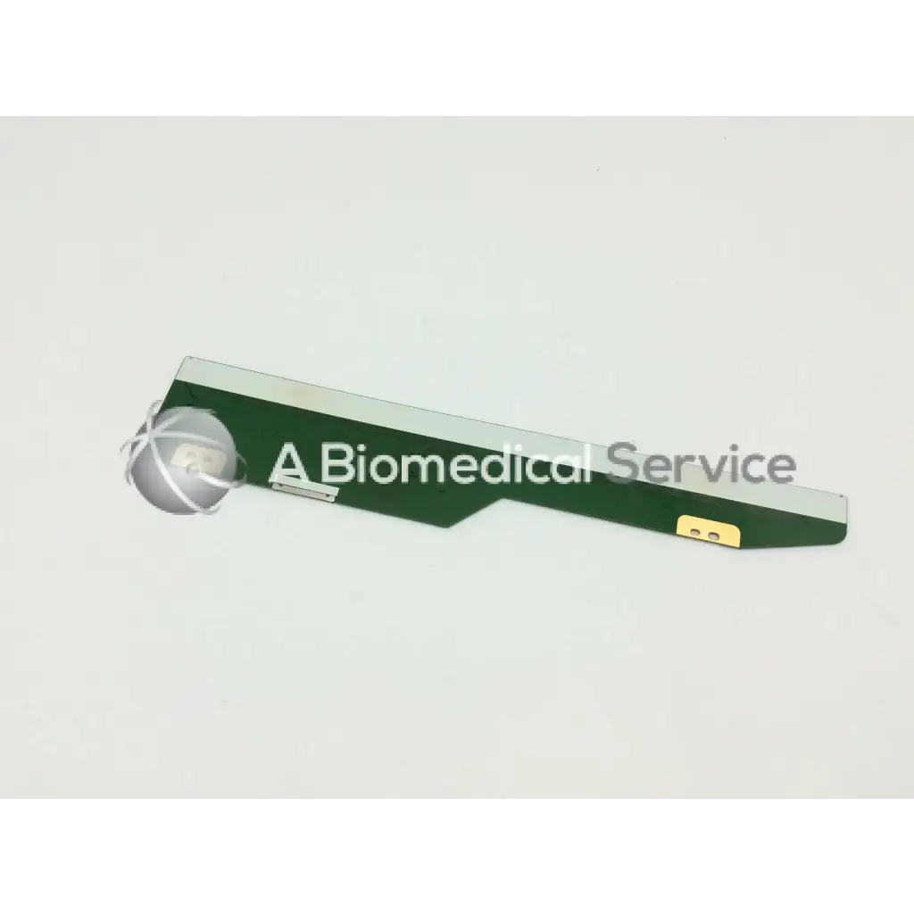 Green and silver philips lcd circuit board lm201u05-sll1 with a spherical metallic medical device component attachment