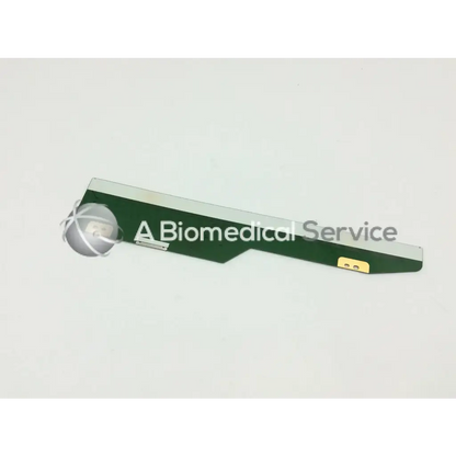 Green and silver philips lcd circuit board lm201u05-sll1 with a spherical metallic medical device component attachment