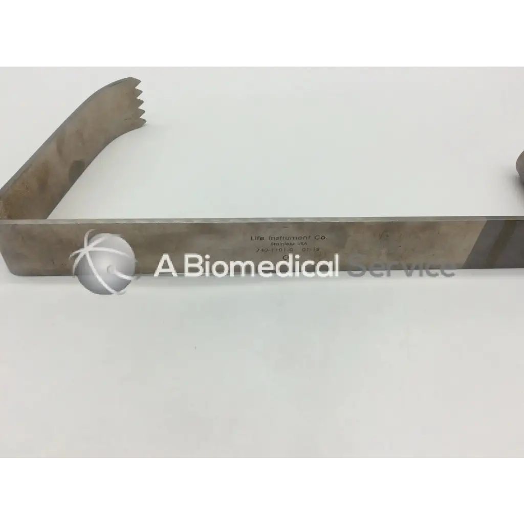 Metallic silver life instruments mcelroy retractor with serrated edge and engraved markings for surgical use