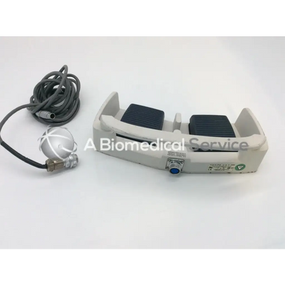 Gray and black linemaster aquiline 971-swnom harmonic scalpel footswitch with coiled cable and metallic sensor attachment