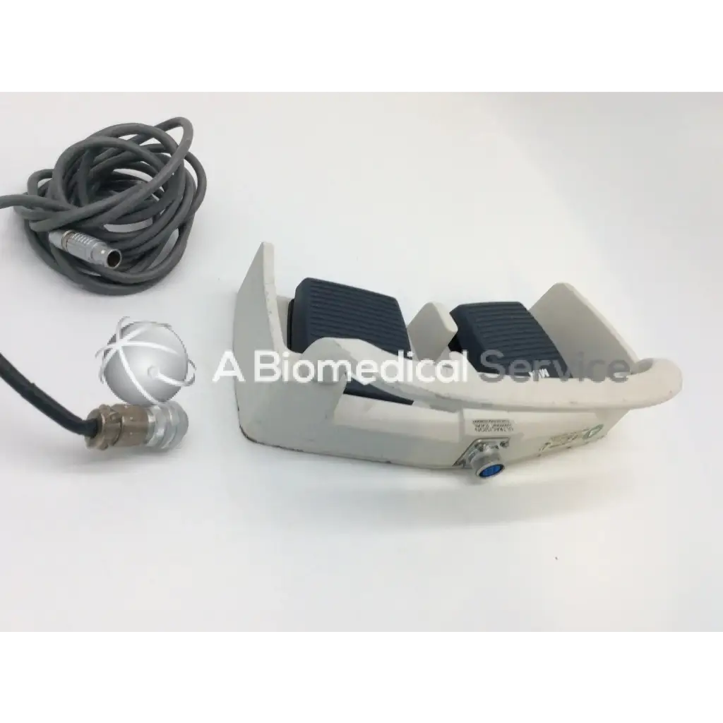 Gray plastic linemaster aquiline harmonic scalpel footswitch with black textured pads and coiled gray cable for ultracision