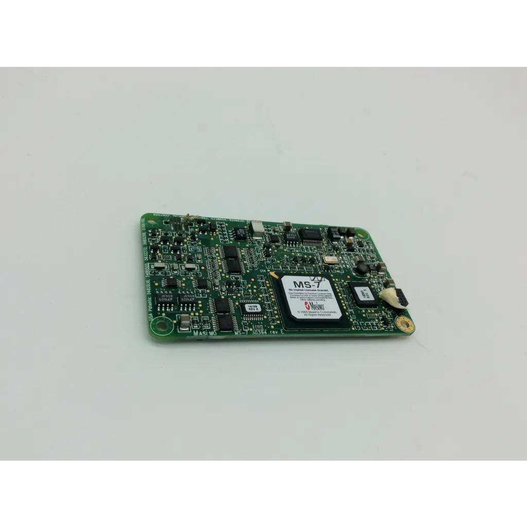 Green pcb board with black integrated circuits and white label ms-7 from masimo spo2 ms-11 product line