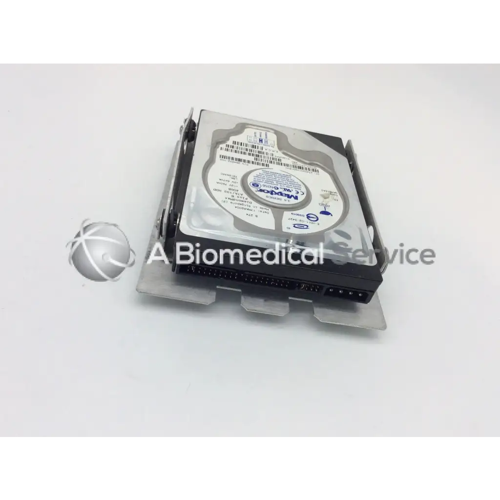 Silver and black maxtor diamondmax plus8 hard drive 40gb with circular label featuring blue text diamondmax plus8 ata