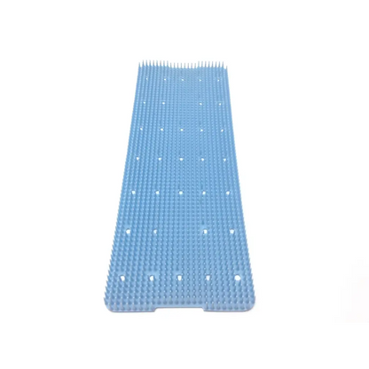 Blue plastic hairbrush with evenly spaced bristles on delicate instrument tray p7540 for delicate instrument storage
