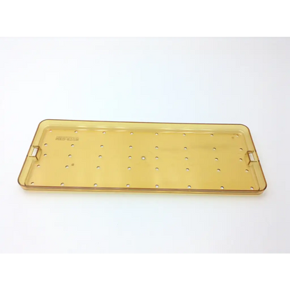 Yellow translucent plastic delicate instrument tray p7540 with evenly spaced holes and small handles on each end