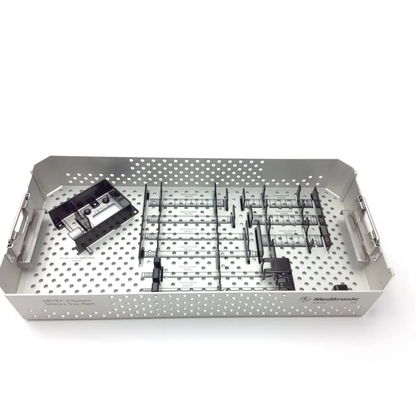 Silver perforated metal metrx surgical case with organized compartments holding black and metallic medical instruments
