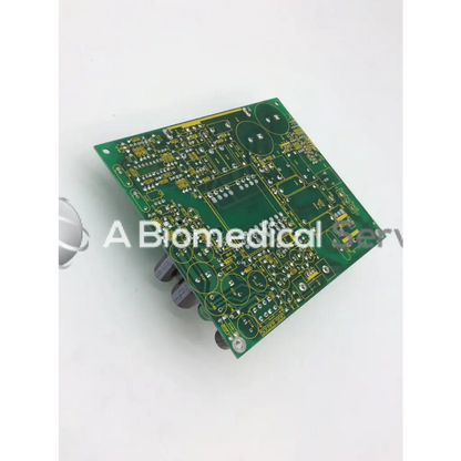 Green rectangular mint mazak circuit board with yellow traces and electronic components model 700156-007 rev a