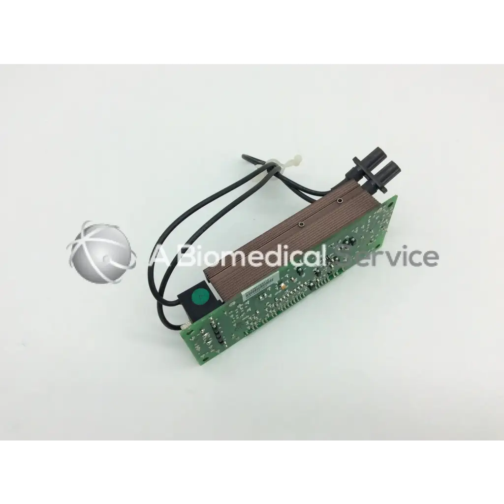 Green circuit board with wooden-textured panel and black cables on mitsubishi 938p069010 lamp ballast back side