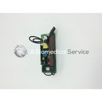 Green circuit board with black wires and brown heat sink showing electronic parts of mitsubishi 938p069010 lamp ballast