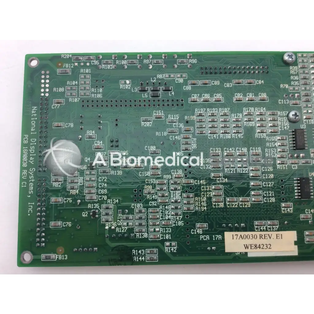 Green printed circuit board with silver components and white label 17a0030 rev in national display 16a0030 rev c1 pcb