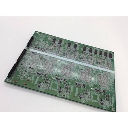 Green printed circuit board with black integrated circuits and silver traces of nd25001-d013 hcmk-m1x control module