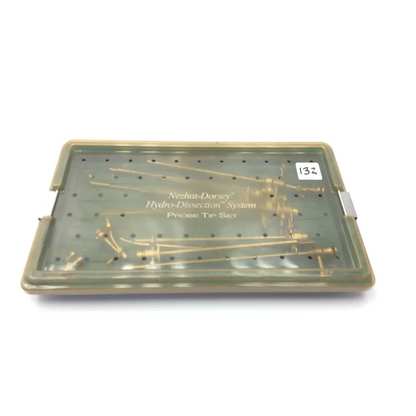 Translucent green plastic case containing gold-colored probe tip set for nezhat-dorsey hydro-dissection system