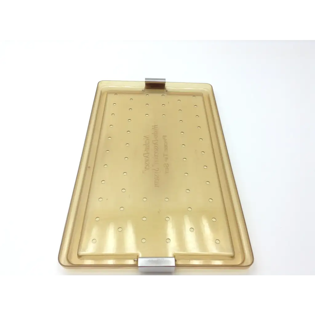 Translucent amber plastic baking tray with grid perforations and metallic clasp hinges for nezhat-dorsey probe tip set