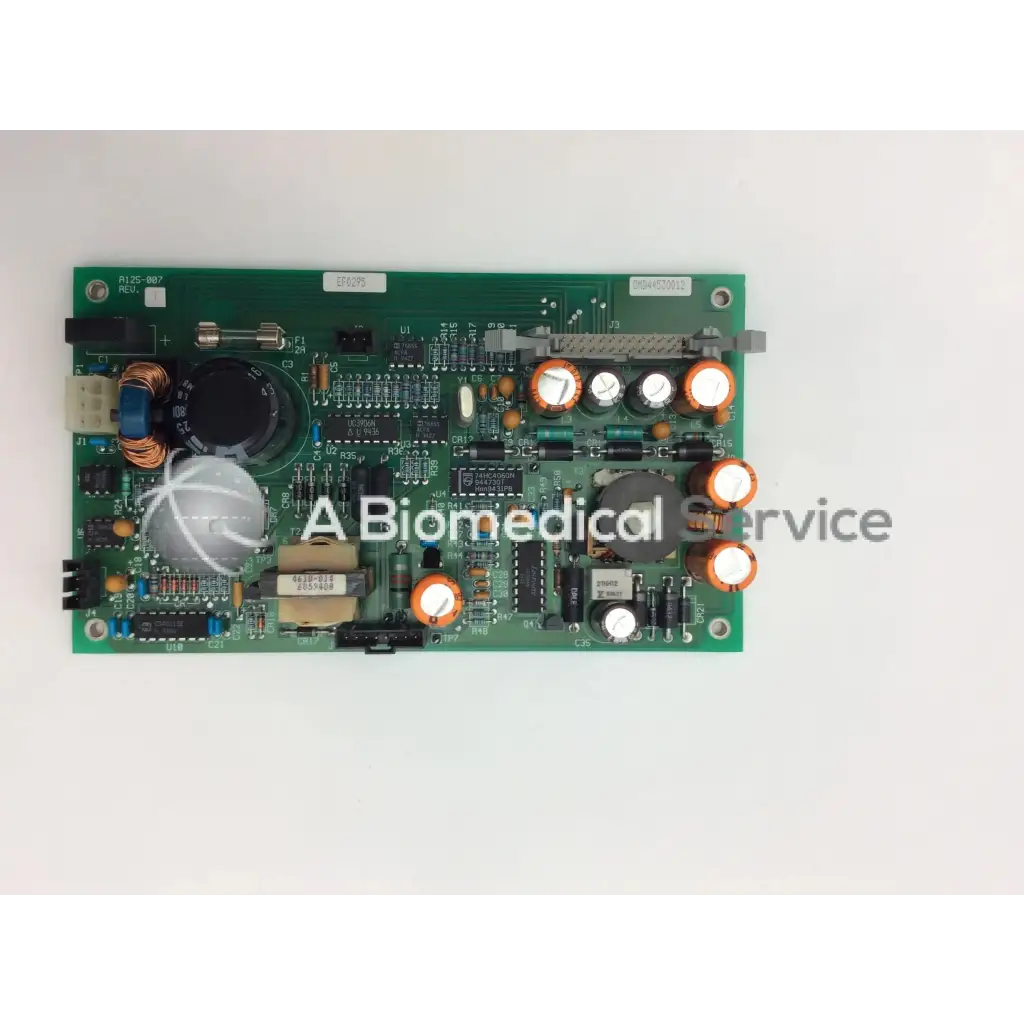 Green rectangular ohmeda a124-007 rev circuit board with capacitors resistors and integrated circuits electronic components