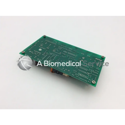 Green rectangular circuit board with silver screws and soldered components of ohmeda a124-007 rev product