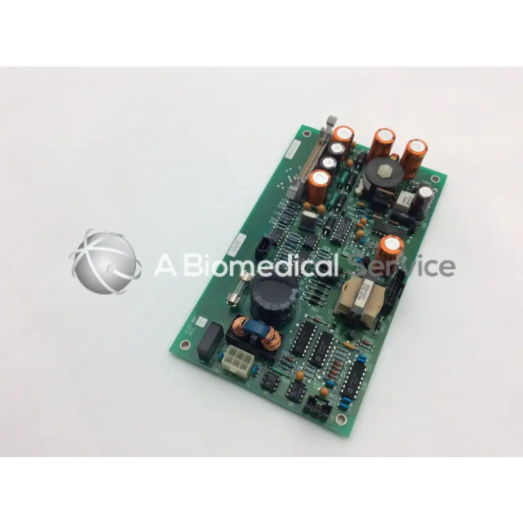 Green printed circuit board of ohmeda a124-007 rev with orange and black capacitors and integrated circuits