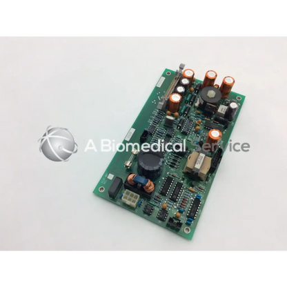 Green printed circuit board of ohmeda a124-007 rev with orange and black capacitors and integrated circuits