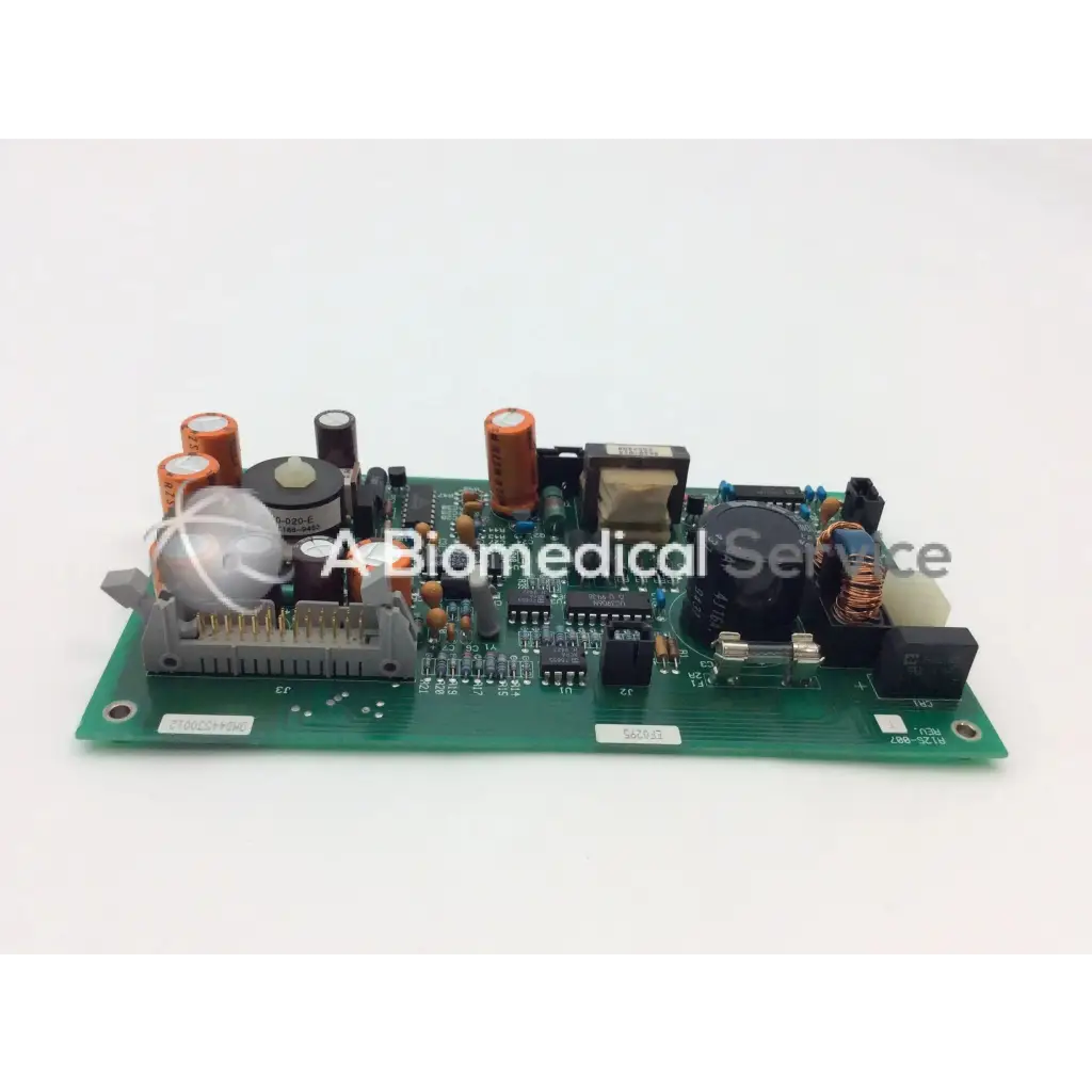 Green printed circuit board with orange capacitors and integrated circuits in ohmeda a124-007 rev electronic module