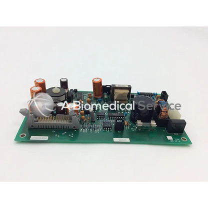 Green printed circuit board with orange capacitors and integrated circuits in ohmeda a124-007 rev electronic module
