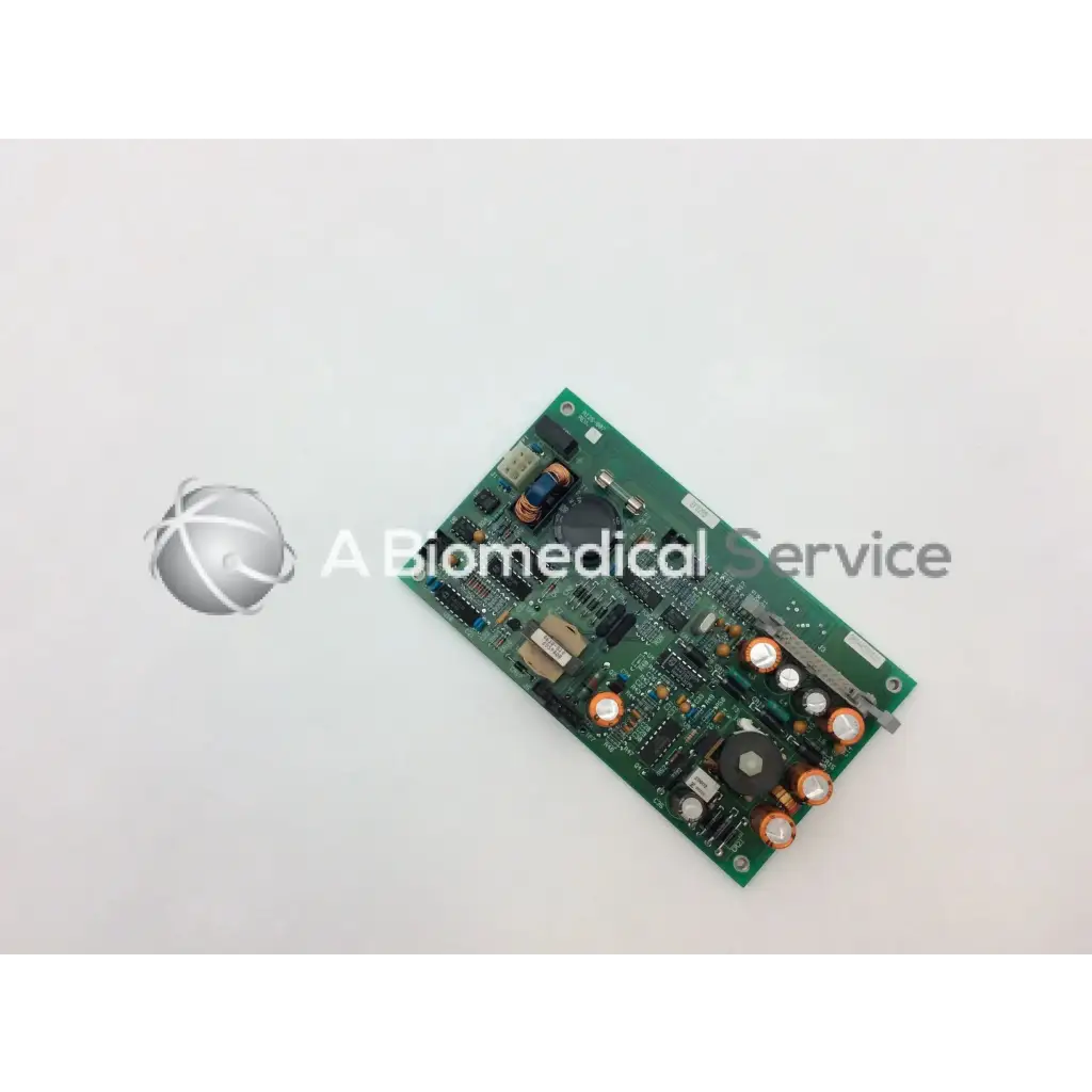 Green rectangular circuit board with electronic components and copper capacitors in ohmeda a124-007 rev product
