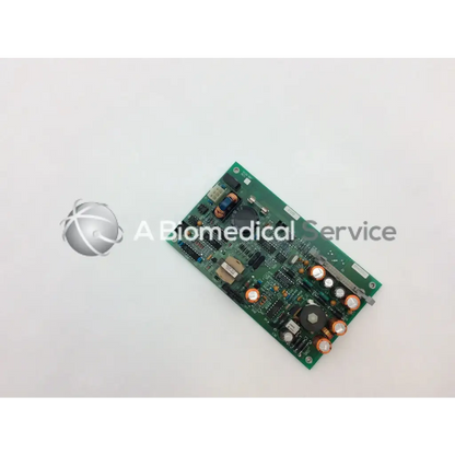 Green rectangular circuit board with electronic components and copper capacitors in ohmeda a124-007 rev product