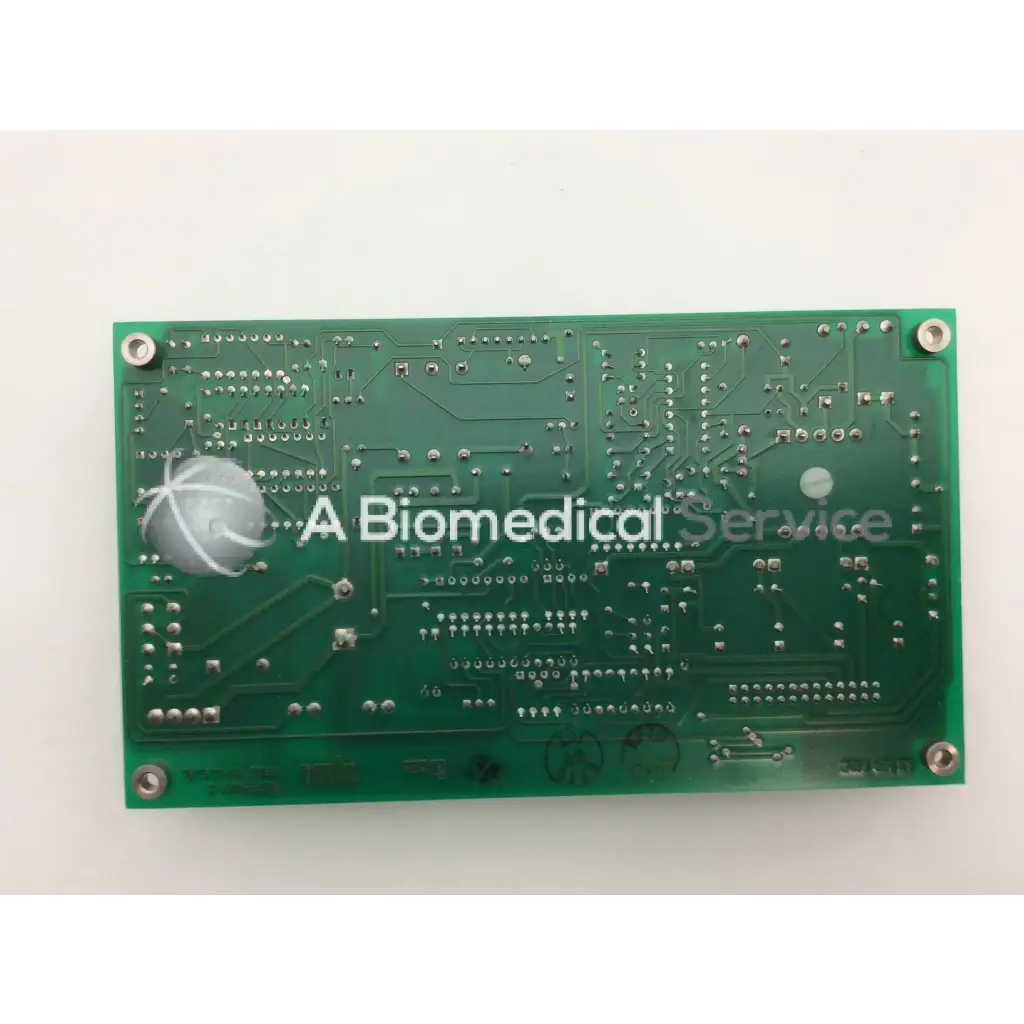 Green rectangular circuit board with silver solder points and component markings for ohmeda a124-007 rev product