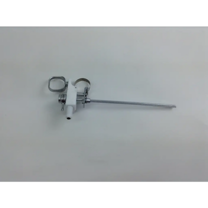 Silver surgical instrument with white plastic handle and metallic parts in olympus cystoscopy resection set with aesculap sterilization case