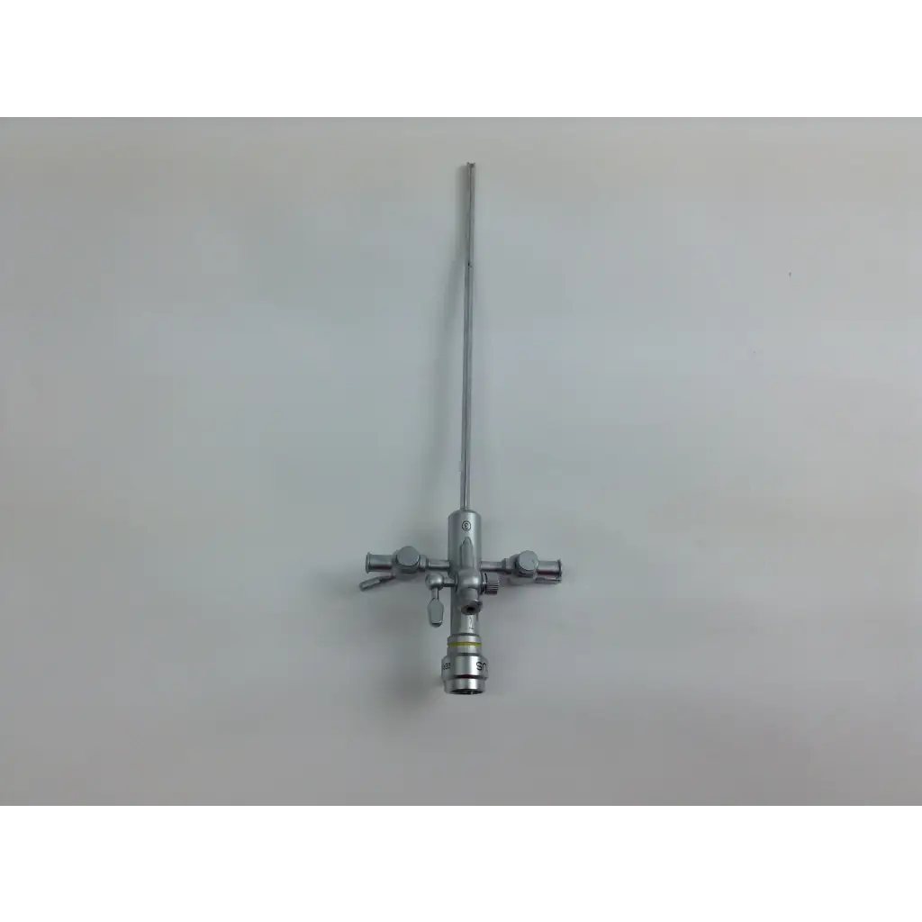 Silver surgical instrument with long slender shaft and control knobs in olympus cystoscopy resection set with aesculap sterilization case