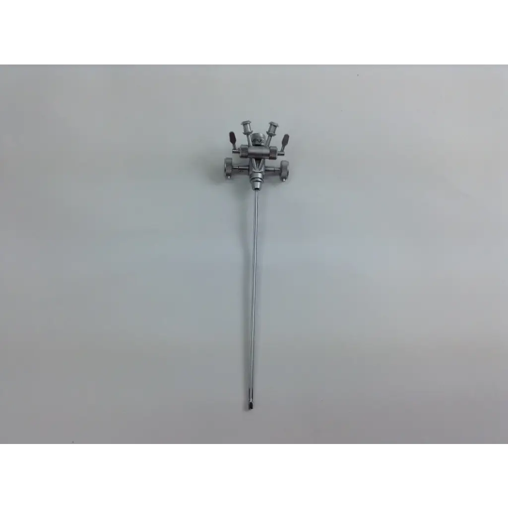 Silver surgical instrument with slender shaft and complex head in olympus cystoscopy resection set with aesculap sterilization case