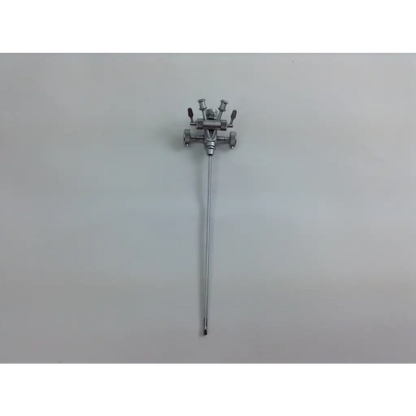 Silver surgical instrument with slender shaft and complex head in olympus cystoscopy resection set with aesculap sterilization case