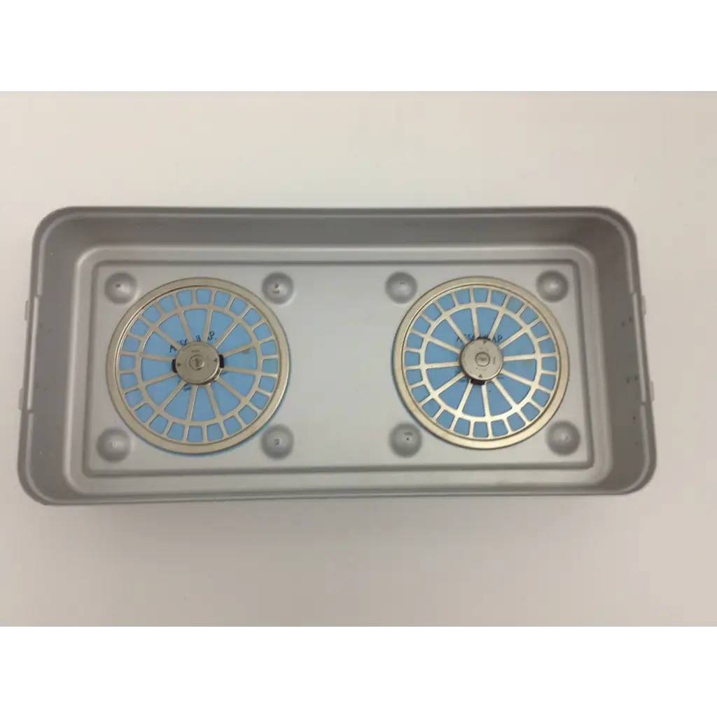 Gray rectangular tray holding two circular blue and silver filter units in olympus cystoscopy resection set with aesculap sterilization case